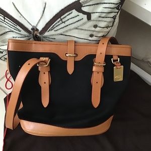 Dooney & Bourke Hobo style black cloth bag with tan leather trimming